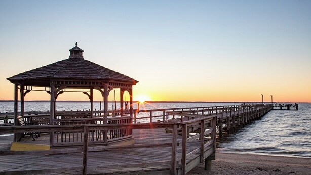 A wooden pier extending into the water with a gazebo at the end. - The Pearl - Waterfront Retreat  • 4BR • 7 Bed • Family / Friends / Pets (Colonial Beach)
