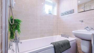 Shower, hair dryer, towels, shampoo