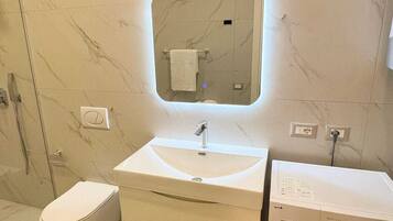 Hair dryer, towels, soap, toilet paper