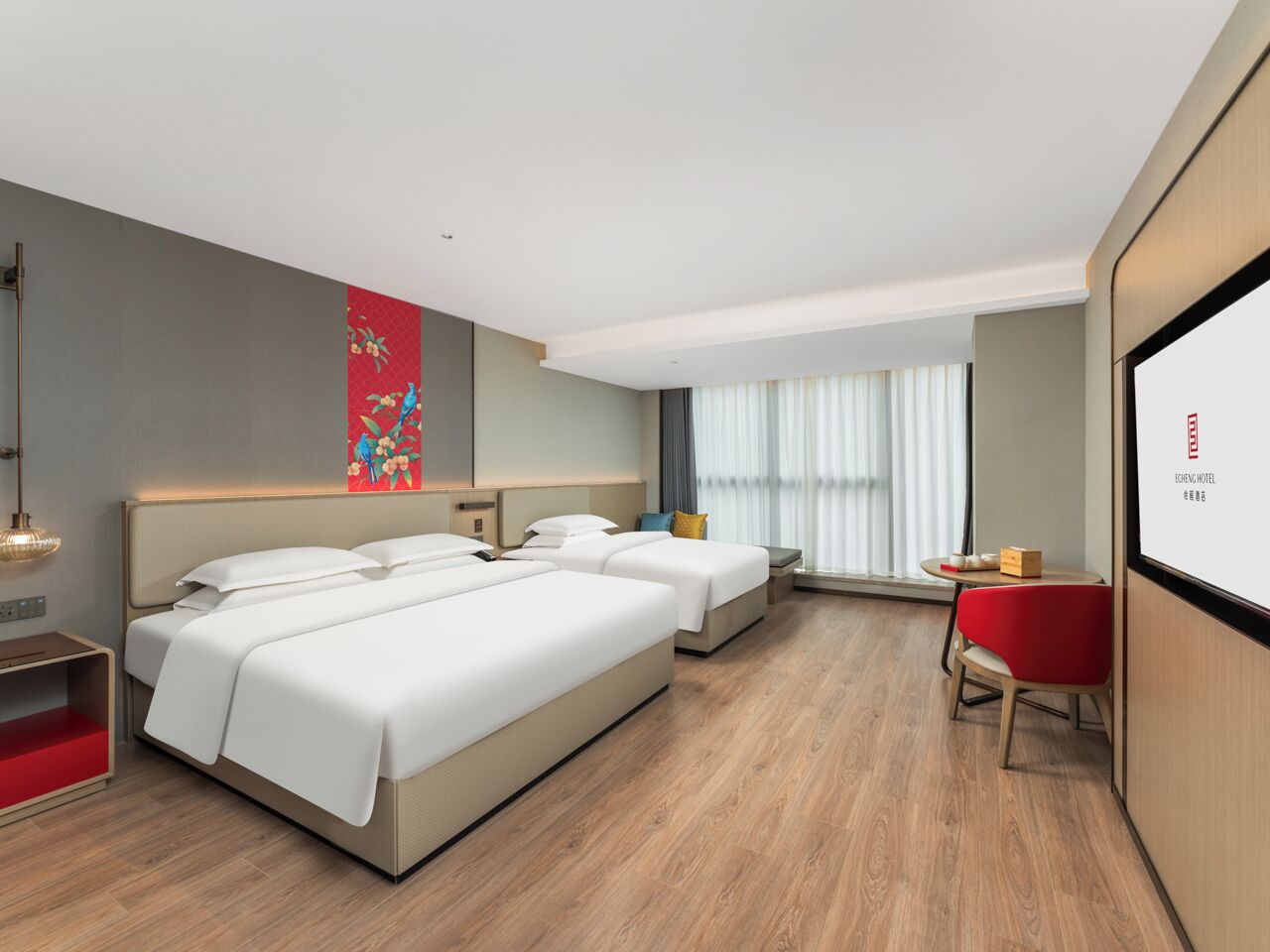 A hotel room with two beds, a small table, a red chair, and a large window with curtains.