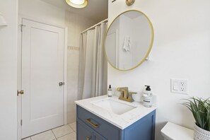 Shower, hair dryer, towels, soap