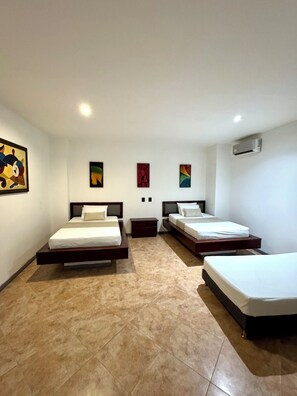 Family Room, Multiple Beds | In-room safe, individually decorated, individually furnished