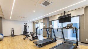 A modern gym with treadmills, weight machines, and exercise balls. - Studios in Building With Gym in Brooklin - SP Emnrs (São Paulo)
