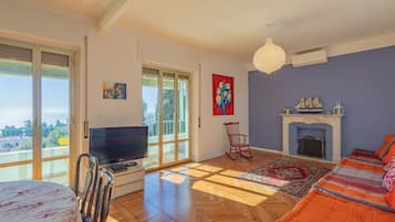Apartment, 2 Bedrooms, Sea View | Living area | 30-inch TV with satellite channels
