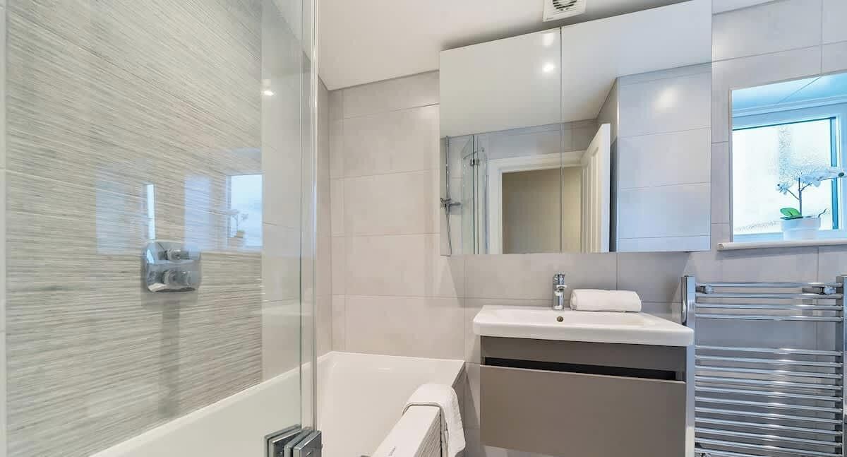 Shower, hair dryer, towels, shampoo