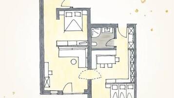 A floor plan of a hotel with multiple rooms, a kitchen area, and a dining space.