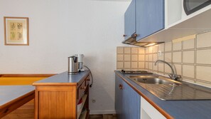 Fridge, microwave, stovetop, cookware/dishes/utensils