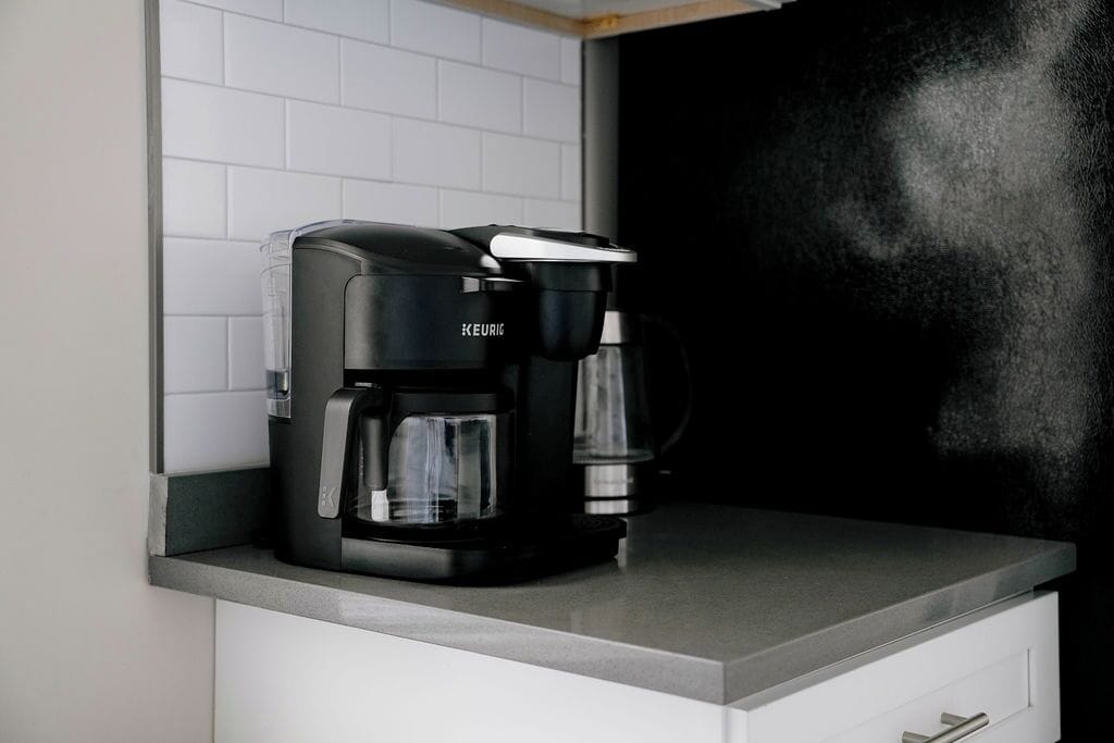 A KEURIC coffee maker on a kitchen counter.