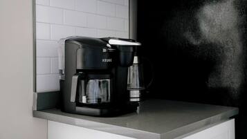 A KEURIC coffee maker on a kitchen counter.
