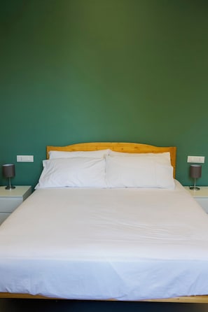 Deluxe Quadruple Room, City View | Blackout drapes, soundproofing, free WiFi, bed sheets