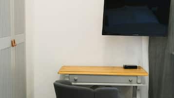 Deluxe Quadruple Room, City View | Blackout drapes, soundproofing, free WiFi, bed sheets