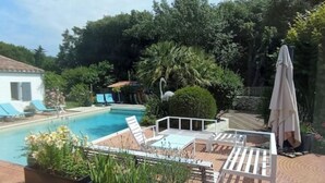 A pool area with lounge chairs, a small building, and lush greenery. - Artist's property/Pool 10X5/garden orchard (Rivedoux-Plage)
