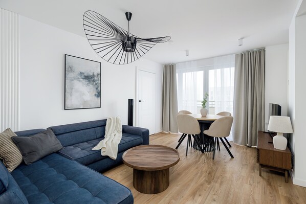 Deluxe Apartment, City View | Living area | 50-inch Smart TV with cable channels, offices - Stockholm by Kairos Apartments (Katowice)