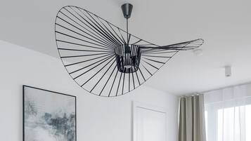 Deluxe Apartment, City View | Living area | 50-inch Smart TV with cable channels, offices