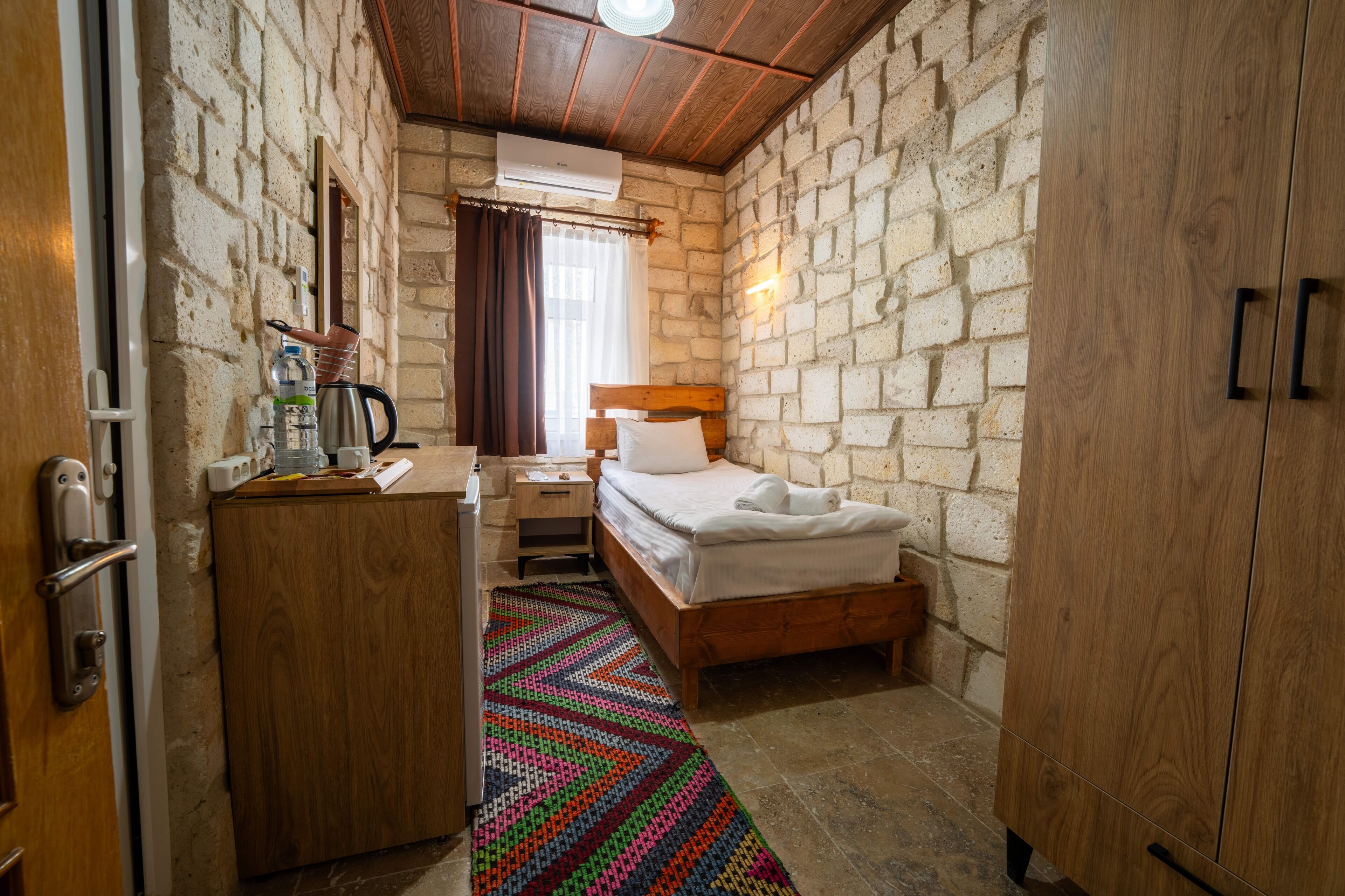 Economy Single Room, City View | Minibar, desk, iron/ironing board, free cribs/infant beds