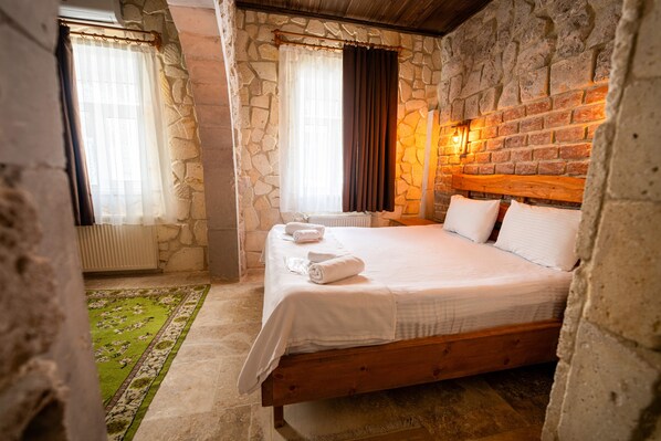 Standard Double Room | Minibar, desk, iron/ironing board, free cribs/infant beds