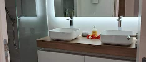 Shower, hair dryer, towels, soap
