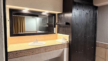 Separate tub and shower, towels, soap, shampoo