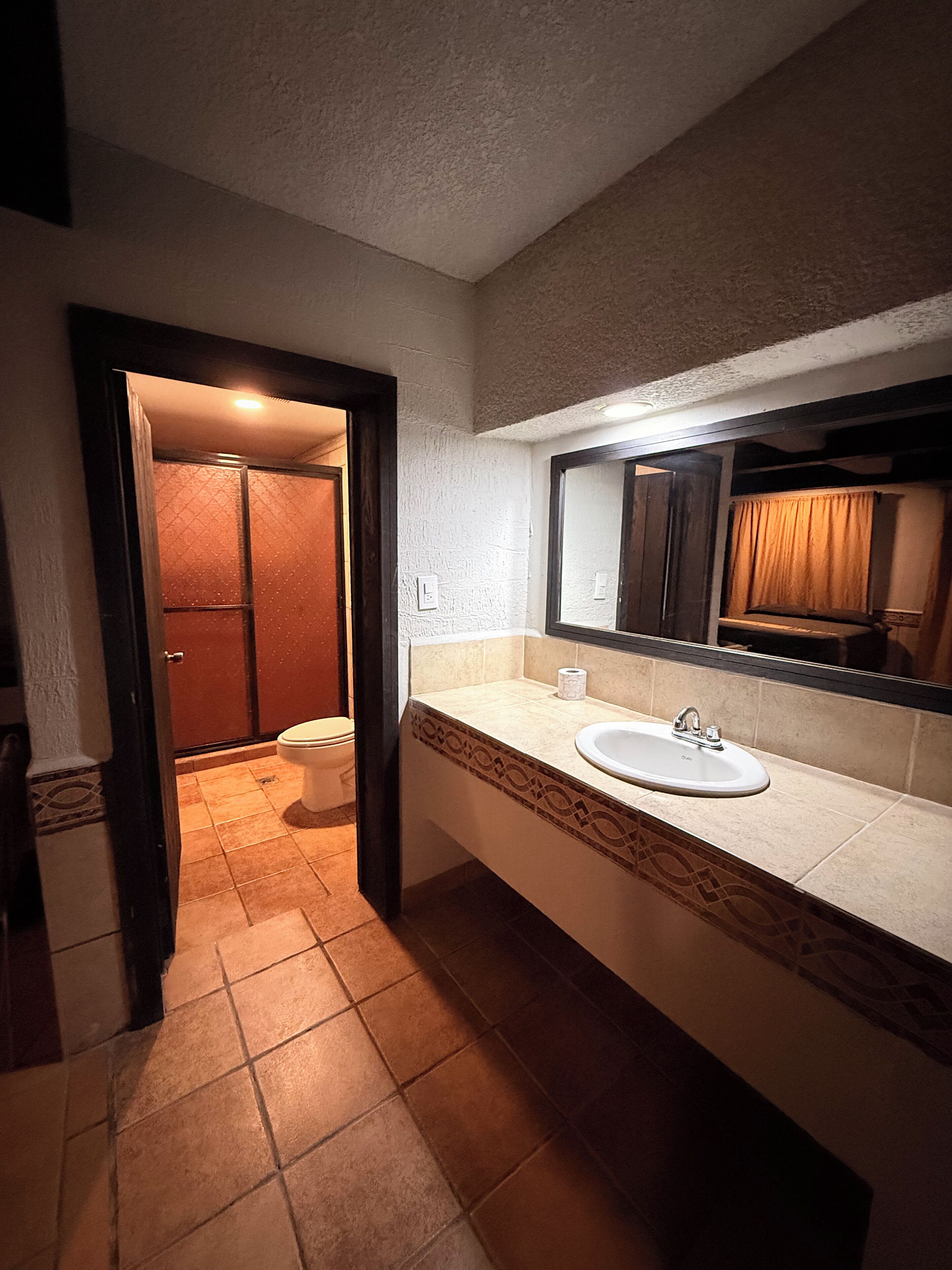 Separate tub and shower, towels, soap, shampoo