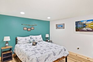 1 bedroom, desk, iron/ironing board, travel crib