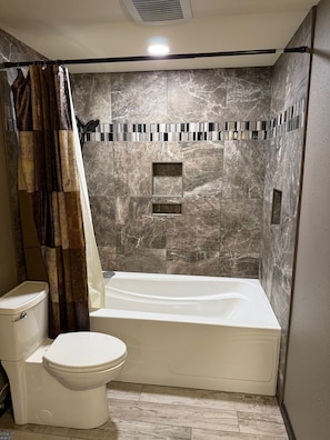 Jetted bath, hair dryer, towels, soap