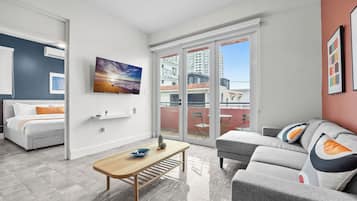 Family Suite, 4 Bedrooms, Balcony, Garden View | Living area