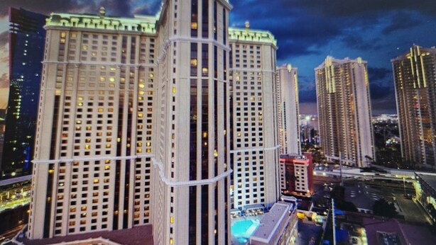 A high-rise hotel with multiple floors, a central atrium, and a pool area. - Steps from the Las Vegas Strip Perfect Condo for National Rodeo Finals Event (Las Vegas)