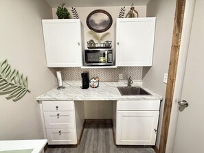 Fridge, microwave, coffee/tea maker, toaster