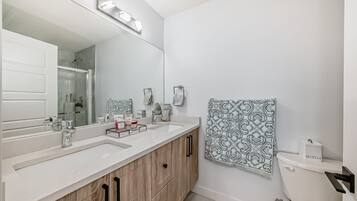 Hair dryer, towels, soap, toilet paper