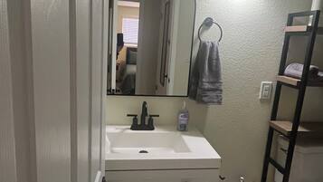 Hair dryer, towels, soap, toilet paper