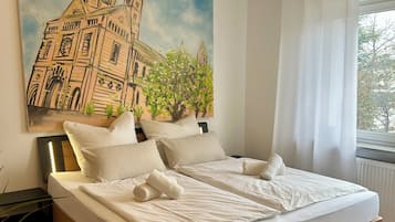 1 dormitori i roba de llit