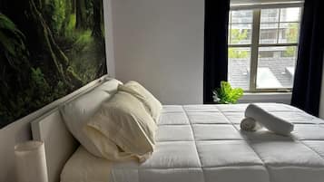 Deluxe Room, City View | 1 bedroom, desk, laptop workspace, blackout drapes
