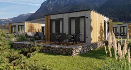 Discover the Stanzertal Cabin at Camping Arlberg, a modern and sustainable accommodation with views of the Alps. Comfort, nature, and style come together for an unforgettable holiday, perfect for any season.