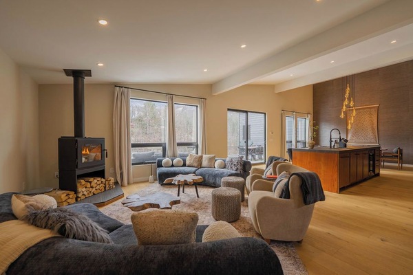 Light-filled living room with mountain views and comfortable seating for your entire group.