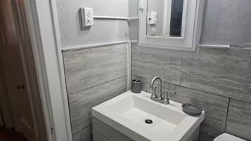 Shower, towels, soap, toilet paper