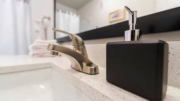 Shower, hair dryer, towels, toilet paper