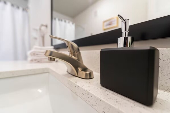 Shower, hair dryer, towels, toilet paper