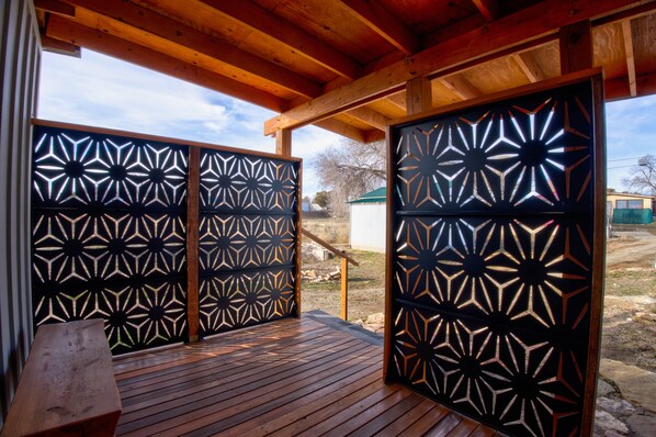 Front porch with privacy screens.
