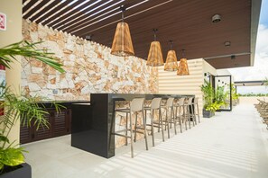 Outdoor dining - Chic Condo • Rooftop Pool • Heart of Playa (Playa del Carmen)