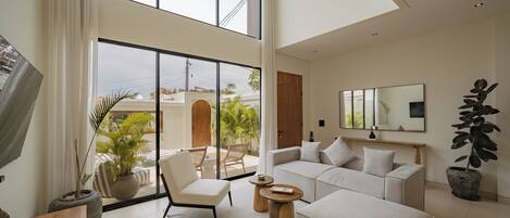 Deluxe Villa, 2 Bedrooms, Patio, Pool View | Living room | 50-inch TV with cable channels