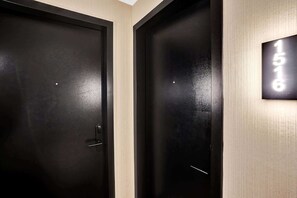 Two black doors with a lighted number sign above them. - Bay View Studio | Rooftop Pool, Downtown Miami (Miami)