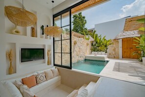 Deluxe Villa, 1 King Bed, Patio, Pool View | Living room | 43-inch TV with cable channels - MaÏa Villa Bingin (Pecatu)