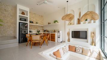 Deluxe Villa, 1 King Bed, Patio, Pool View | Living room | 43-inch TV with cable channels