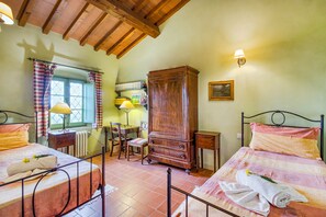 A bedroom with two beds, a wooden wardrobe, a desk with a chair, and a window with curtains. - Villa Salivolpe Amazing Chianti View 8, San Casciano VDP, Italy (San Casciano VDP)