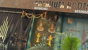 A sign for Casa Royal Residency with a contact number. - CR Residency By Glitz Hotels (Mumbai)