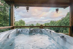 A hot tub with a view of mountains and trees. - Star View- Honeymoon Cabin| Mountain View| Hot Tub (Bryson City)