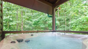 A hot tub with a view of a forest. - Starry Night- Honeymoon Cabin| Hot Tub| Near GSMNP (Bryson City)