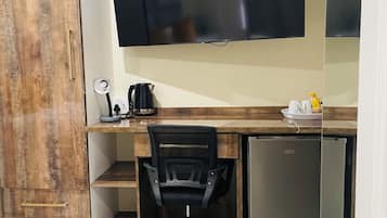 Standard Apartment, Garden View | In-room safe, desk, laptop workspace, iron/ironing board