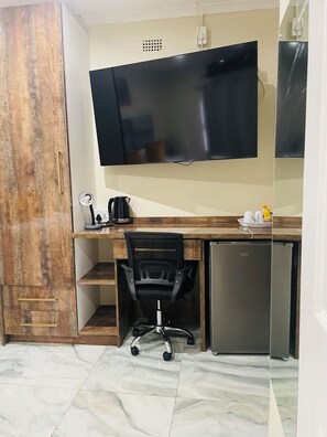 Standard Apartment, Garden View | In-room safe, desk, laptop workspace, iron/ironing board