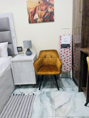 Standard Apartment, Garden View | In-room safe, desk, laptop workspace, iron/ironing board